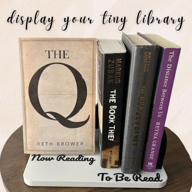 Book holder shelf holding a stack of novels